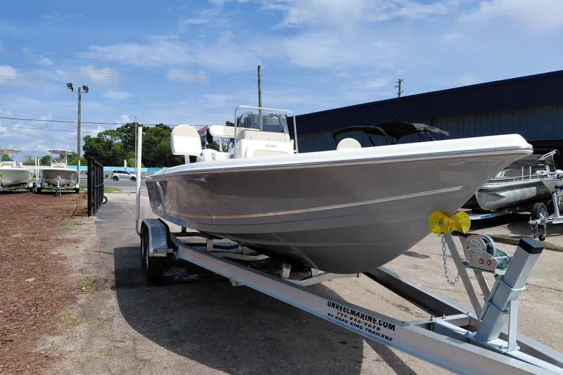 Slide: The Image of 2027 Bulls Bay 2200 XS boat on trailer under clear sky. - 8