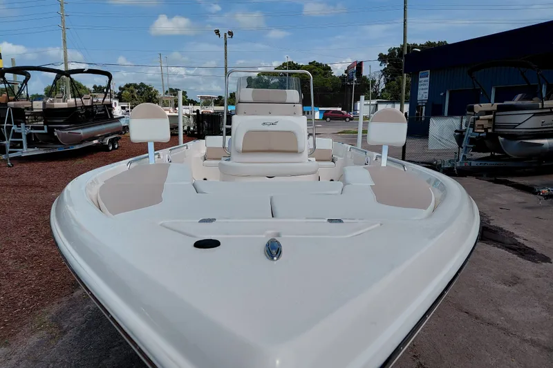 Slide: The Image of 2027 Bulls Bay 2200 XS boat with sleek design, parked outdoors under a clear sky. - 11