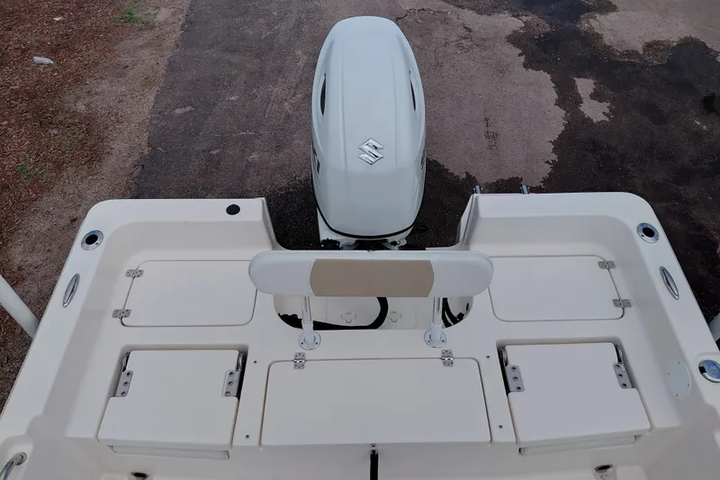 Slide: The Image of 2027 Bulls Bay 2200 XS boat stern view with outboard motor and storage compartments. - 30