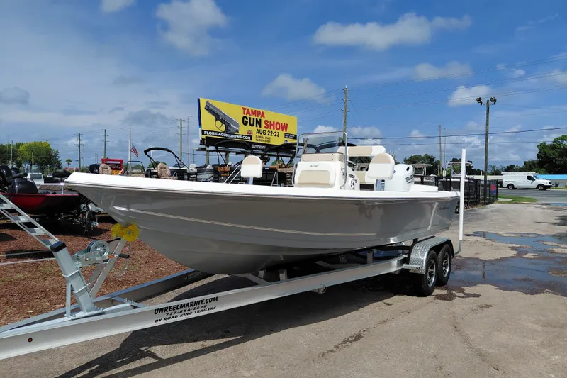 Slide: The Image of 2027 Bulls Bay 2200 XS boat on trailer under clear blue sky. - 10