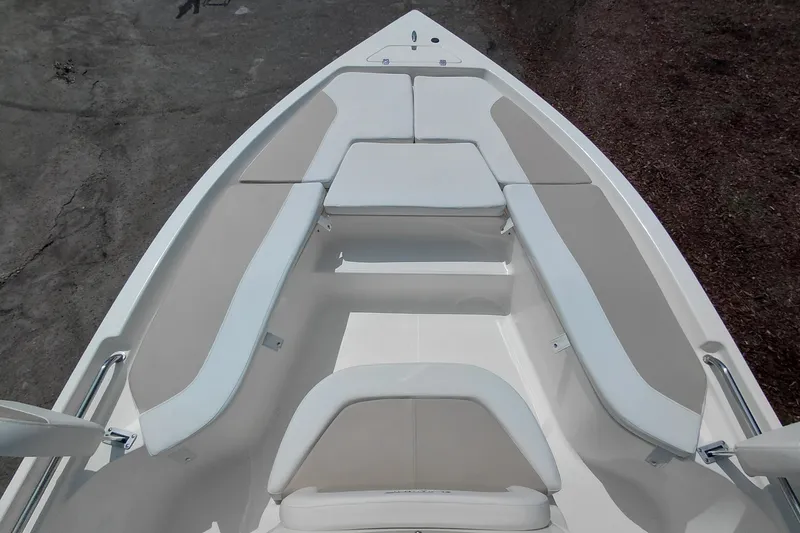 Slide: The Image of 2027 Bulls Bay 2200 XS boat interior with cushioned seating and sleek design. - 17