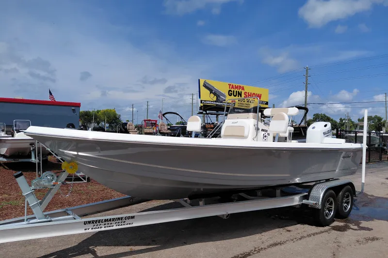 The Image of 2027 Bulls Bay 2200 XS boat on trailer, displayed outdoors under a clear sky. - 1