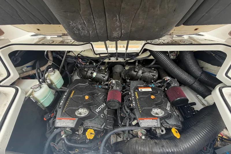 Slide: The Image of Engine compartment of a 2018 Scarab 255 ID boat, featuring dual Rotax engines. - 67