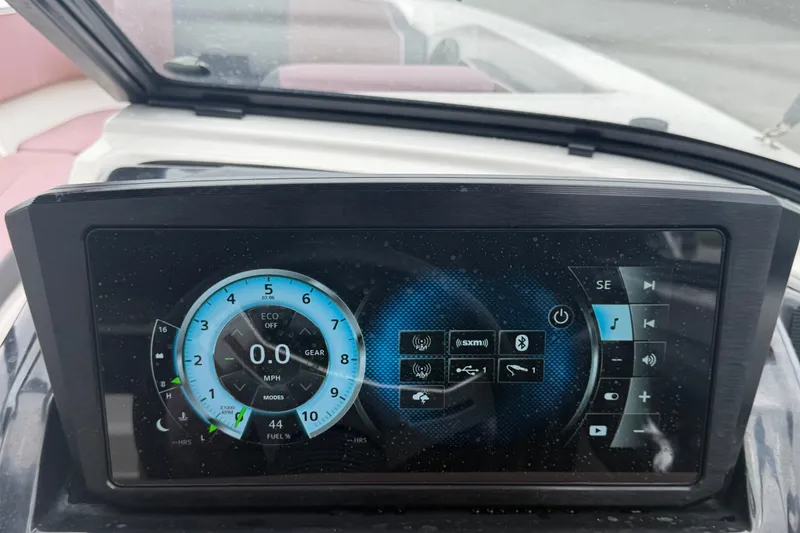 Slide: The Image of Dashboard display of a 2018 Scarab 255 ID boat showing speedometer and controls. - 26