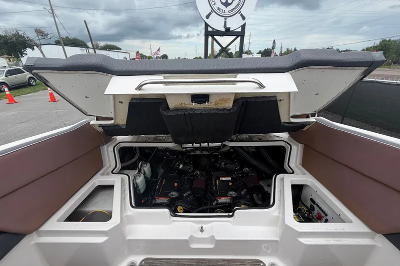 Slide: The Image of Open engine compartment of 2018 Scarab 255 ID boat, showcasing internal components and design. - 65