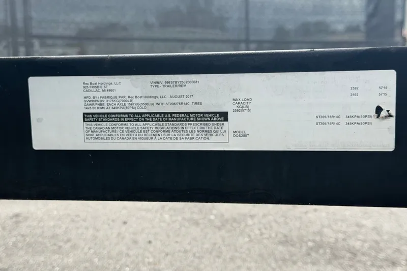 Slide: The Image of Label on Scarab 255 ID trailer, detailing specifications and compliance information. - 80