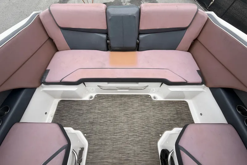 Slide: The Image of 2018 Scarab 255 ID boat interior with pink and gray seating arrangement. - 63