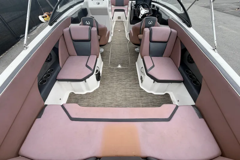 Slide: The Image of Interior of a 2018 Scarab 255 ID boat with pink and gray seating. - 15