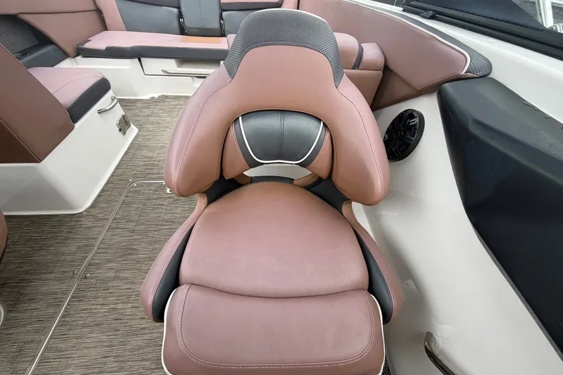 Slide: The Image of Luxurious seating in 2018 Scarab 255 ID boat, featuring brown and black upholstery. - 56