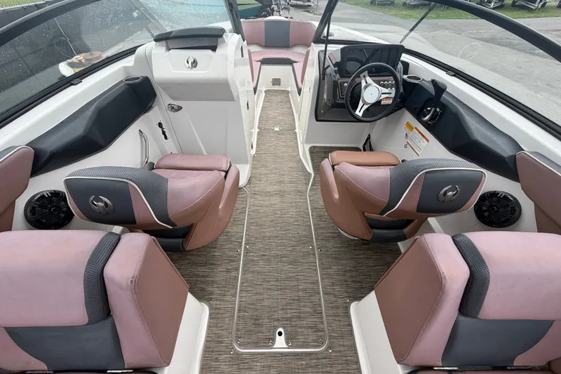 Slide: The Image of 2018 Scarab 255 ID boat interior with modern seating and steering wheel. - 19