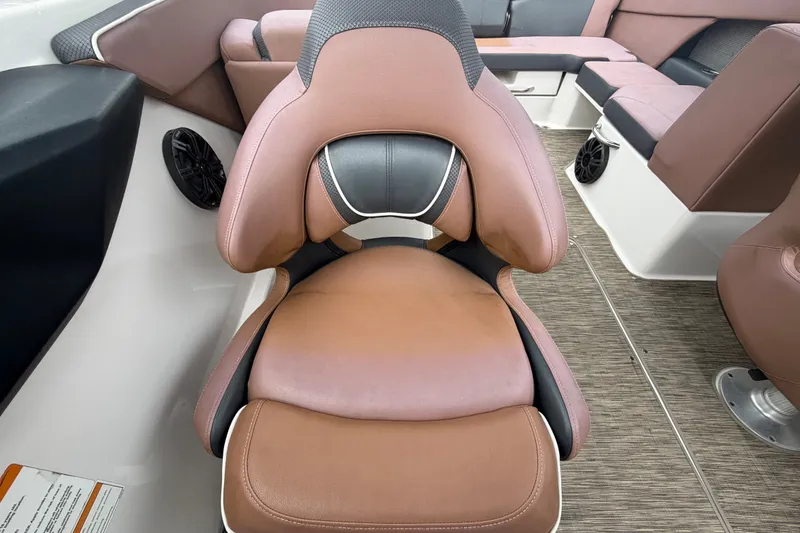 Slide: The Image of Brown and black seating in 2018 Scarab 255 ID boat interior. - 55