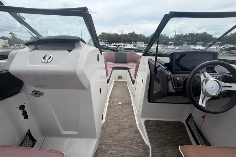 Slide: The Image of 2018 Scarab 255 ID boat interior with modern dashboard and seating. - 30
