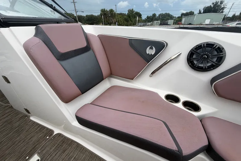 Slide: The Image of 2018 Scarab 255 ID boat interior with purple seating, speaker, and cup holders. - 42