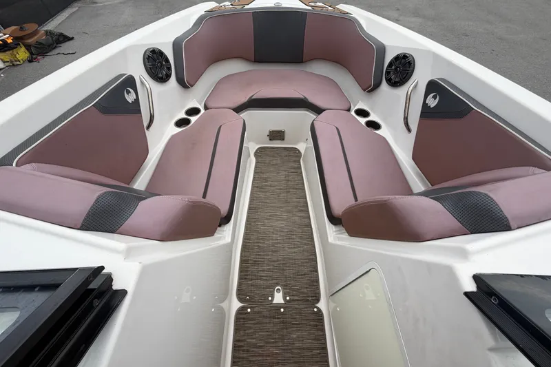 Slide: The Image of Interior of 2018 Scarab 255 ID boat with cushioned seating and cup holders. - 38