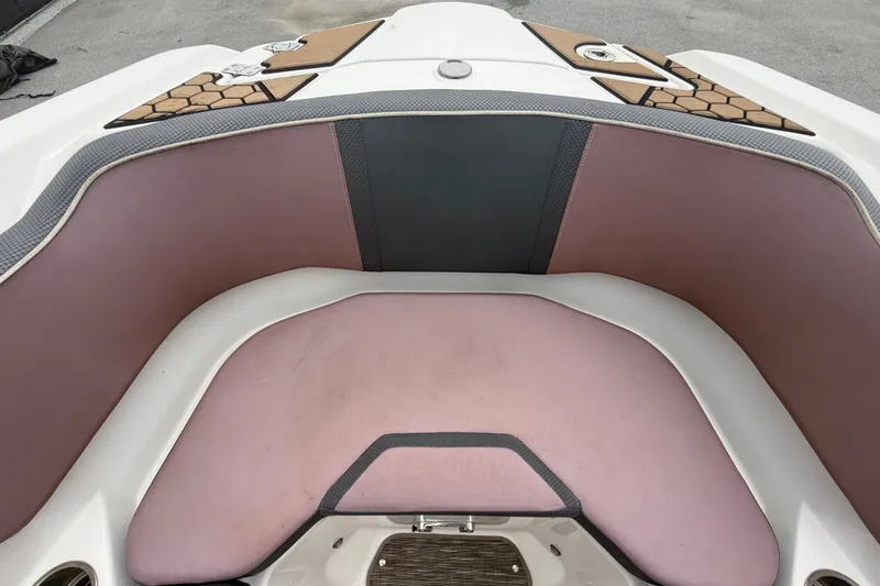 Slide: The Image of Interior seating of a 2018 Scarab 255 ID boat with pink upholstery. - 44
