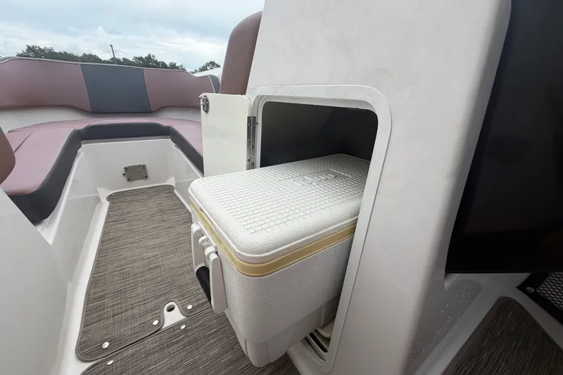 Slide: The Image of Interior of 2018 Scarab 255 ID boat with built-in cooler storage. - 37