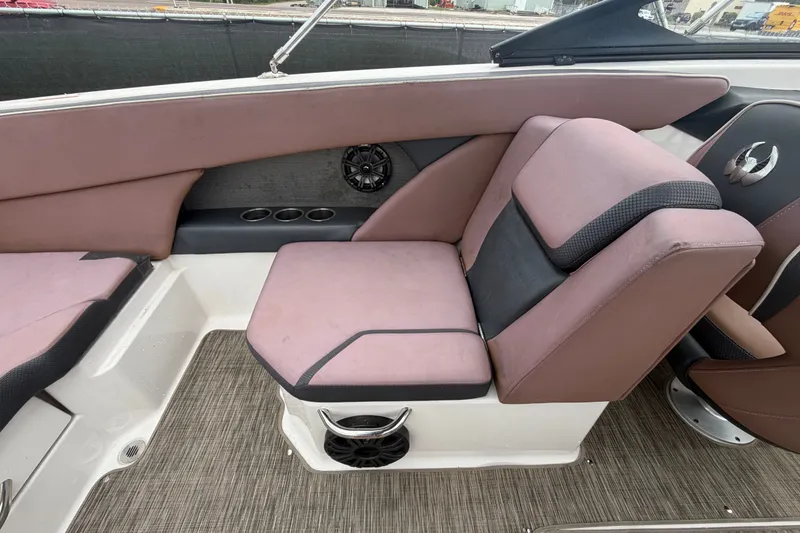Slide: The Image of 2018 Scarab 255 ID boat interior with cushioned seating and speaker system. - 62