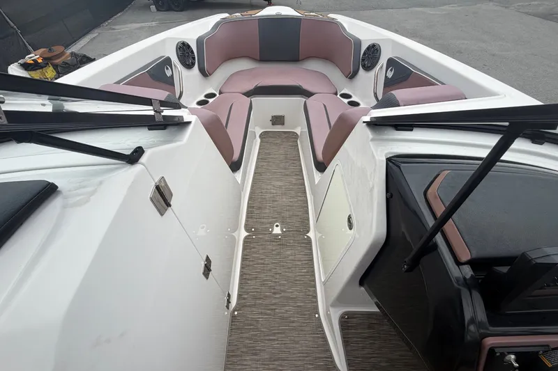 Slide: The Image of 2018 Scarab 255 ID: Spacious bow area with cushioned seating and speakers, ideal for comfort. - 35
