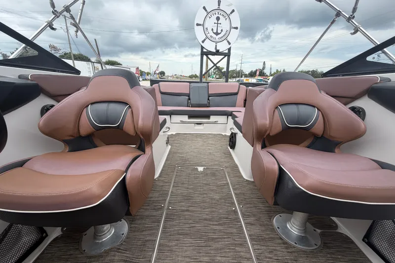 Slide: The Image of 2018 Scarab 255 ID boat interior with brown leather seats and modern design. - 54