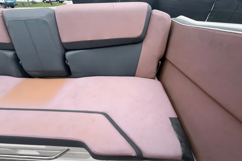 Slide: The Image of Rear seating of a 2018 Scarab 255 ID boat with pink and gray upholstery. - 72