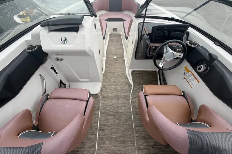 Slide: The Image of Interior of 2018 Scarab 255 ID boat with modern seating and steering wheel. - 23