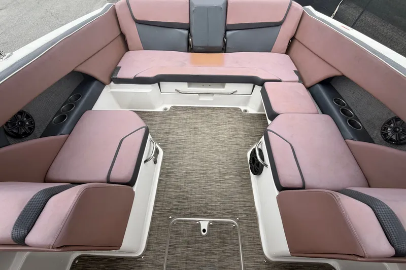 Slide: The Image of Luxurious seating area of 2018 Scarab 255 ID boat with plush cushions and integrated speakers. - 58