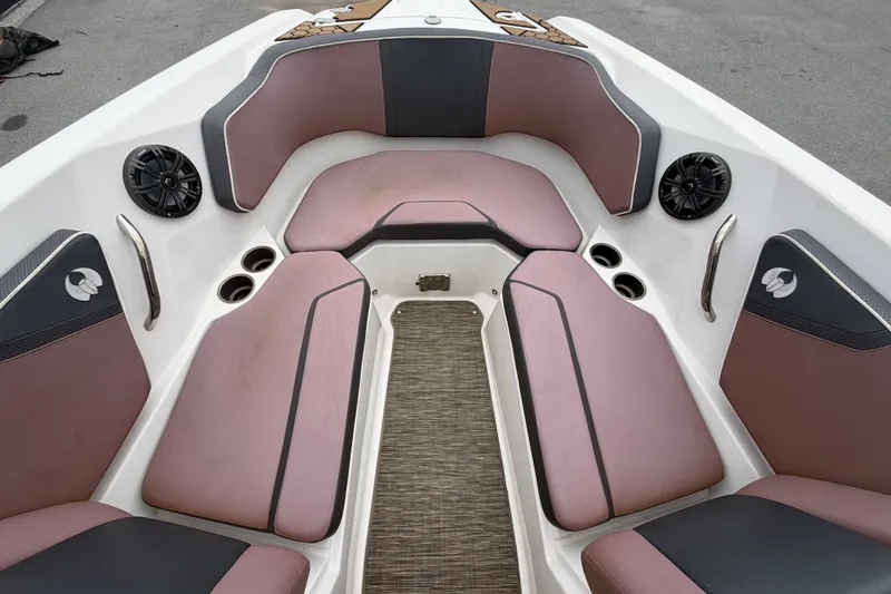 Slide: The Image of Interior of a 2018 Scarab 255 ID boat with cushioned seating and speakers. - 41