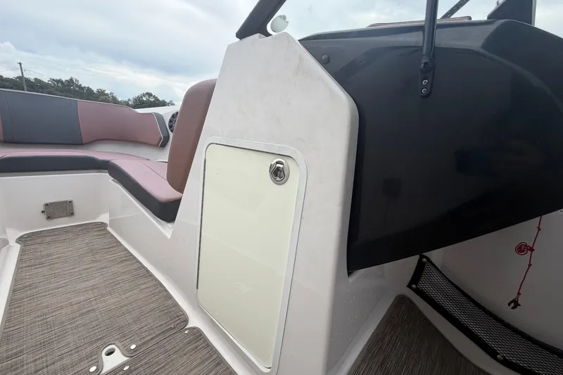 Slide: The Image of Interior view of 2018 Scarab 255 ID boat, featuring seating and storage compartment. - 36