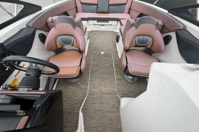 Slide: The Image of Interior of 2018 Scarab 255 ID boat with stylish seating and steering wheel. - 53