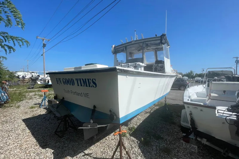Slide: The Image of 1996 Outlaw Marine 25' boat named "FN Good Times" in South Portland, ME, on dry dock. - 6