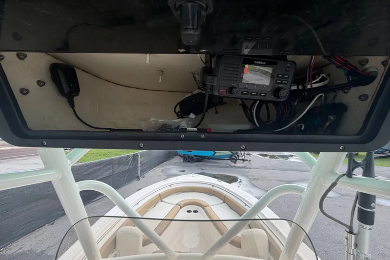 Slide: The Image of 2021 Pioneer 222 Islander boat with Garmin electronics in storage compartment. - 20