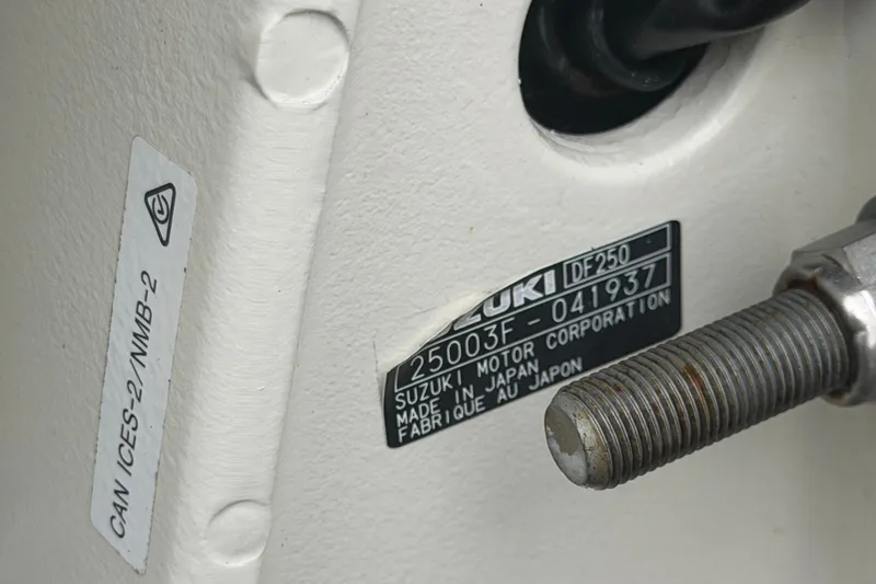 Slide: The Image of Close-up of Suzuki DF250 engine label on 2021 Pioneer 222 Islander boat. - 68