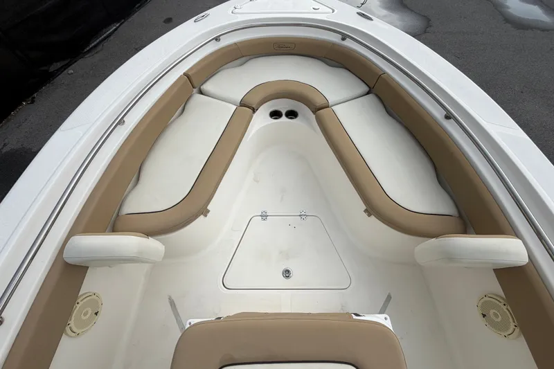 Slide: The Image of 2021 Pioneer 222 Islander boat interior with tan and white seating, spacious layout. - 36