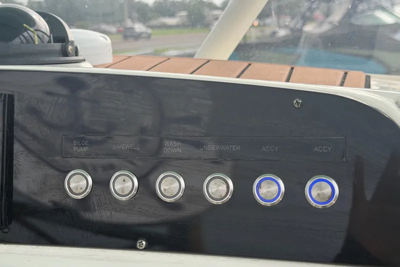 Slide: The Image of Control panel of 2021 Pioneer 222 Islander boat with labeled buttons. - 25