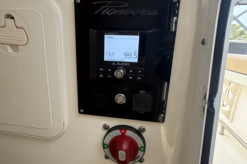 Slide: The Image of Control panel of 2021 Pioneer 222 Islander boat with JL Audio system displaying FM 99.5. - 35