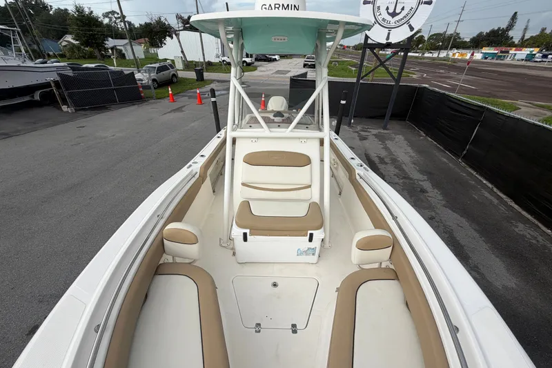 Slide: The Image of 2021 Pioneer 222 Islander boat with tan seating and Garmin equipment. - 48
