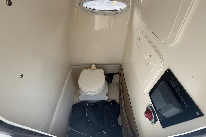 Slide: The Image of Compact marine toilet inside 2021 Pioneer 222 Islander boat cabin. - 32