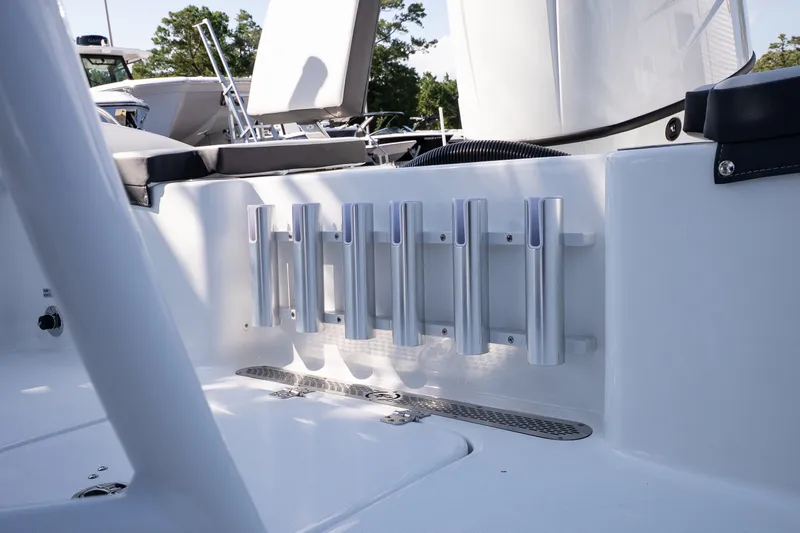 Slide: The Image of 2026 Sea Pro 202 Center Console boat interior with rod holders and seating. - 19