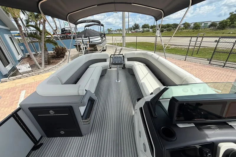 Slide: The Image of 2027 Bennington 26 MSB USA 250 Limited Edition pontoon boat interior with seating and canopy. - 17