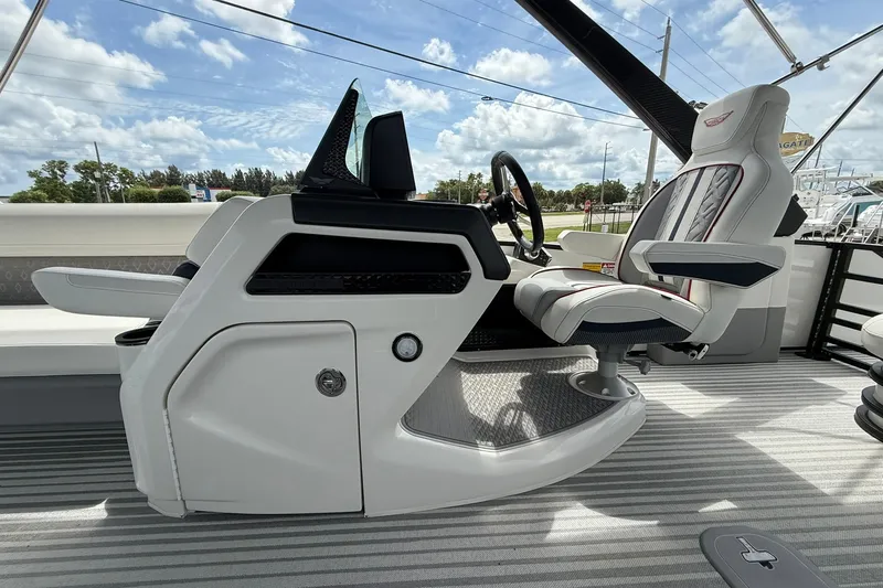 Slide: The Image of 2027 Bennington 26 MSB USA 250 Limited Edition boat interior with sleek captain's chair and console. - 16