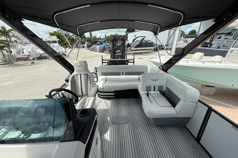 Slide: The Image of Luxurious 2027 Bennington 26 MSB USA 250 Limited Edition pontoon boat interior with plush seating. - 15