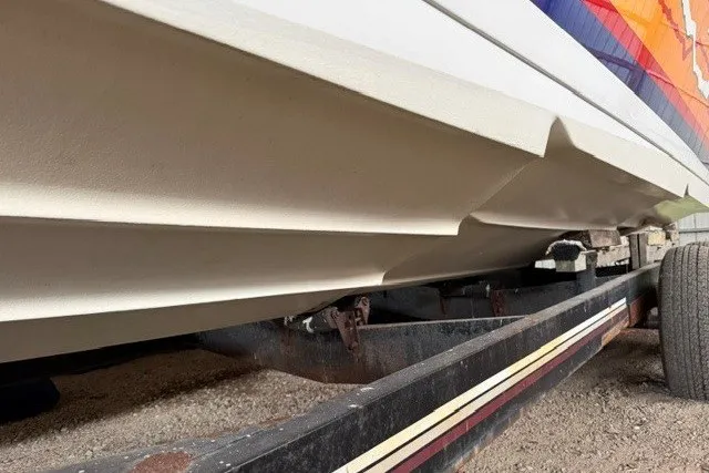 Slide: The Image of 2008 Formula 353 FASTech boat hull on trailer, showcasing sleek design and vibrant graphics. - 3