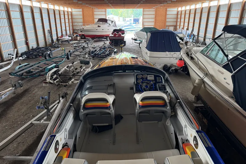 Slide: The Image of 2008 Formula 353 FASTech boat in storage, surrounded by trailers and other boats. - 19