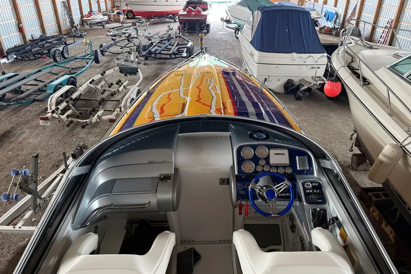 Slide: The Image of 2008 Formula 353 FASTech boat interior with vibrant dashboard in storage facility. - 20