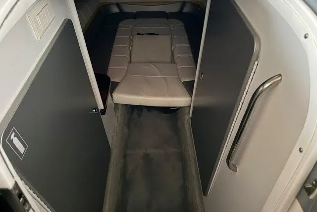 Slide: The Image of Interior cabin of a 2008 Formula 353 FASTech boat, featuring a compact sleeping area. - 31