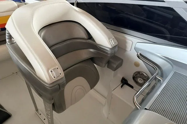 Slide: The Image of 2008 Formula 353 FASTech boat cockpit with cushioned seat and control panel. - 16