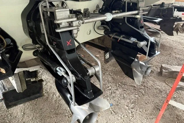 Slide: The Image of 2008 Formula 353 FASTech boat outdrives on gravel surface, showcasing dual propeller system. - 28