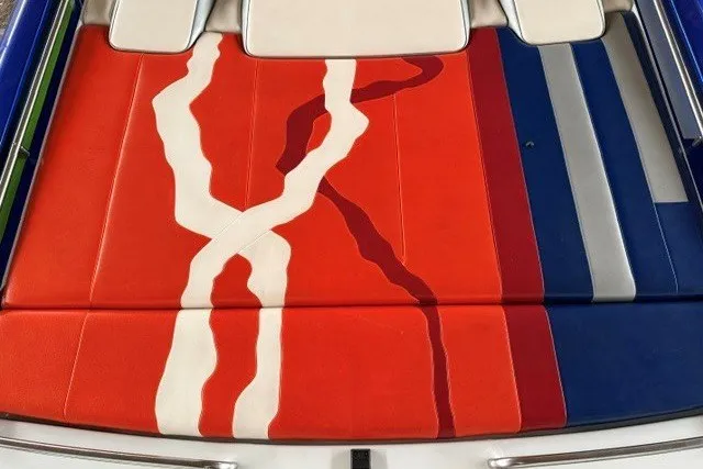 Slide: The Image of 2008 Formula 353 FASTech boat upholstery with vibrant red, white, and blue design. - 18