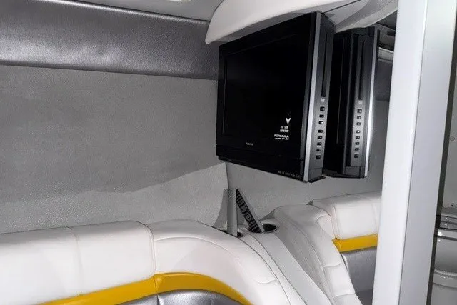 Slide: The Image of Interior of a 2008 Formula 353 FASTech boat with a mounted TV and white seating. - 9