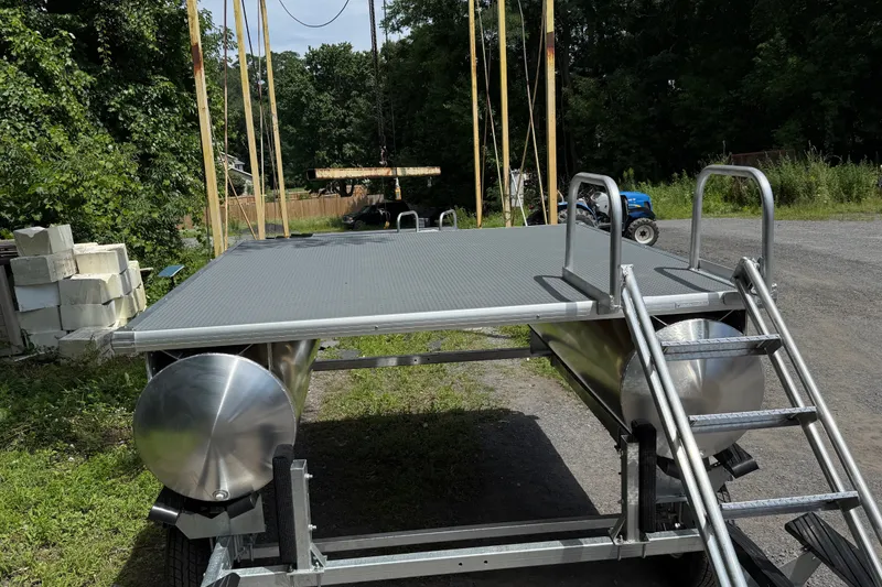 The Image of Aqua Cycle 8'X8' Swim Raft 2026 with ladder, outdoors on a trailer. - 1